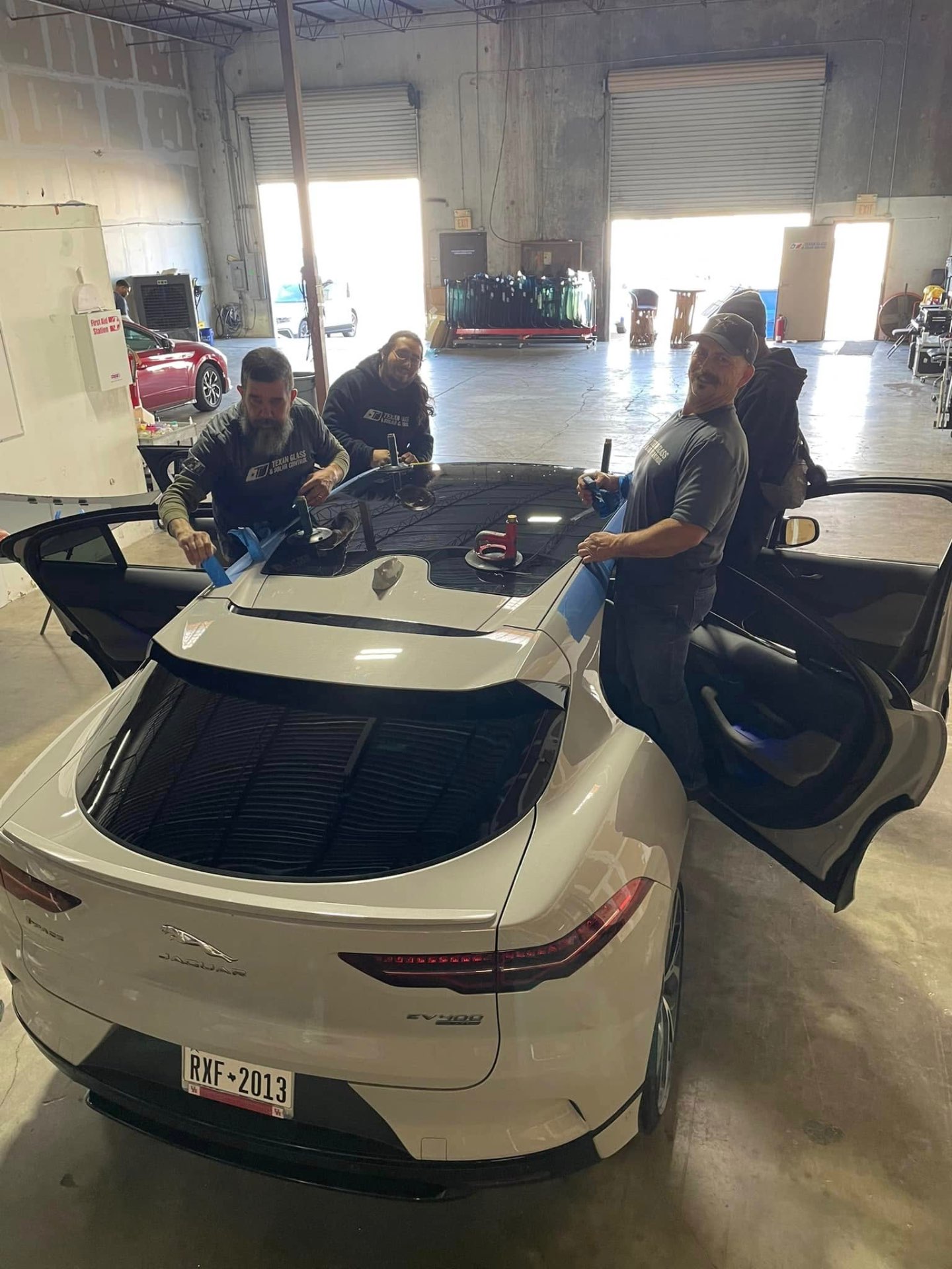 Our certified team installing a new windshield